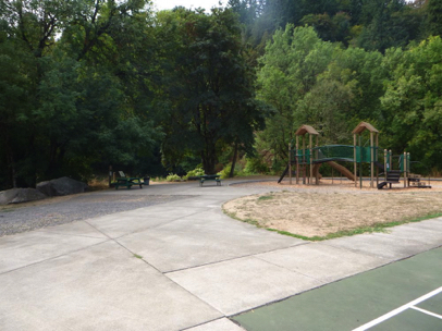 Playground, picnic benches and trailhead off the parking lot